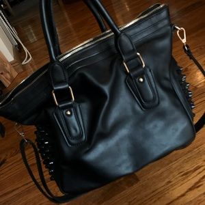 Black studded leather bag